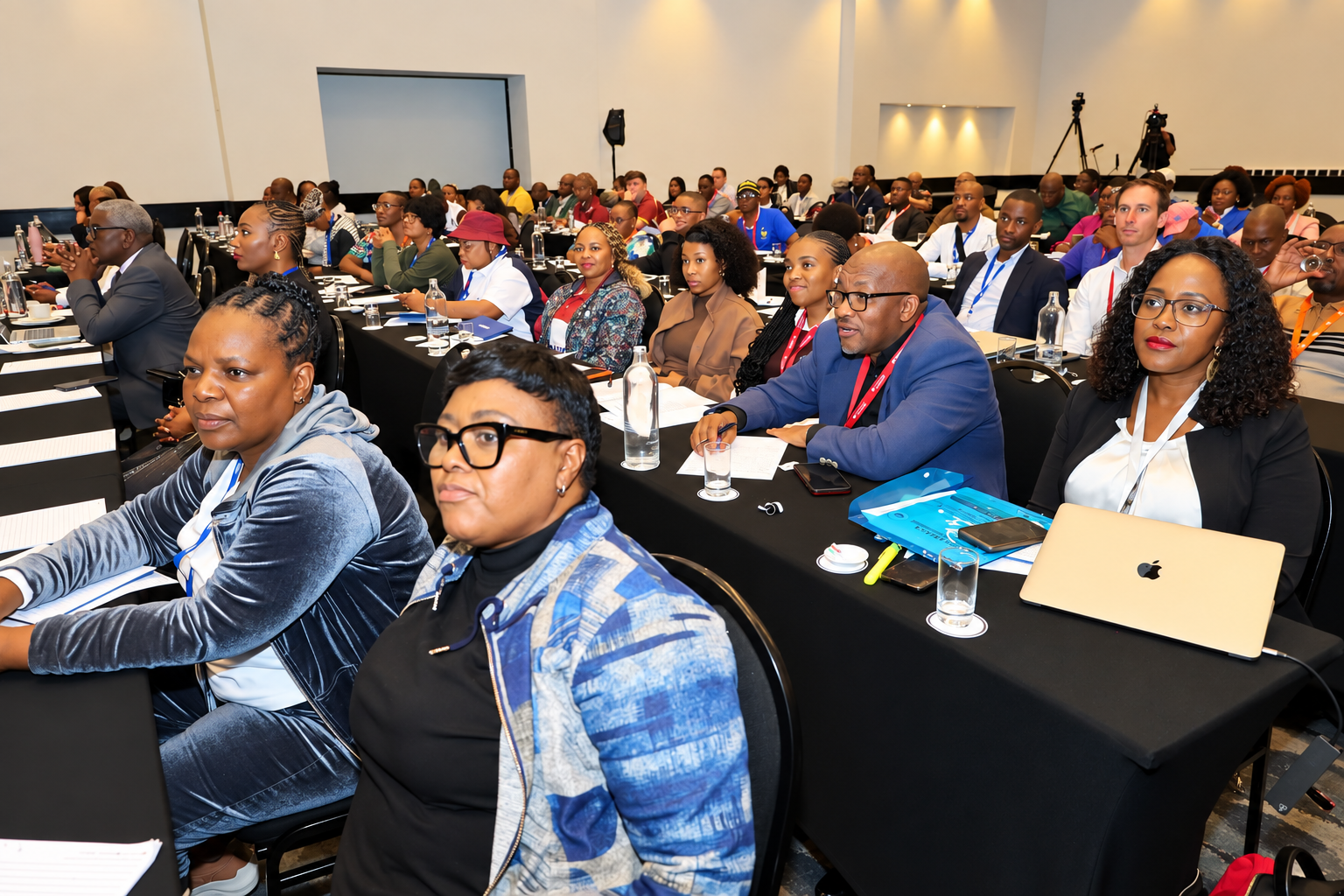 MGSLG representatives engaging with conference participants